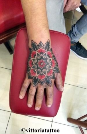 Old School Flower Hand Tattoo