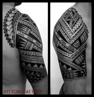polynesian style arm tattoo