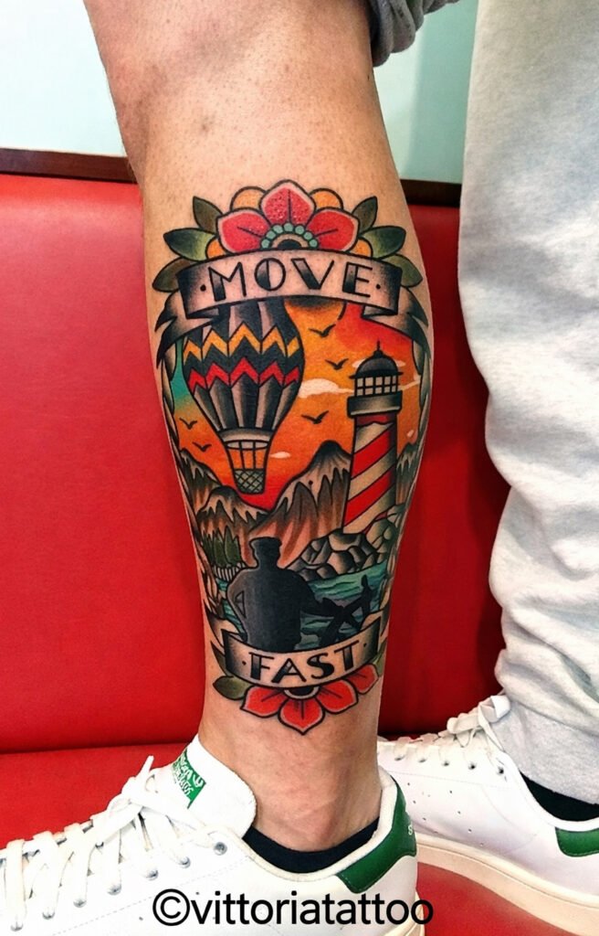 Old school “Move Fast” tattoo on the calf with hot air balloon and lighthouse, done at Vittoria Tattoo Shop in Aubusson.
