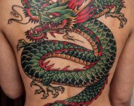 Japanese dragon back tattoo covering the entire back, traditional style, done at Vittoria Tattoo Shop in Aubusson.